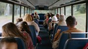 Default_A_bus_full_of_passengers_parents_seen_from_the_back_se_0.jpg